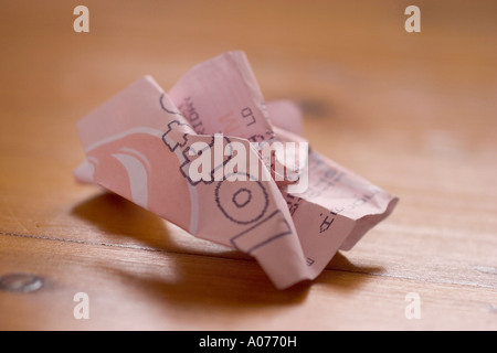 Screwed up and discarded national lottery lotto ticket from national lottery of UK Stock Photo