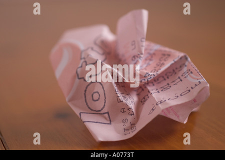Screwed up and discarded national lottery lotto ticket from national lottery of UK Stock Photo