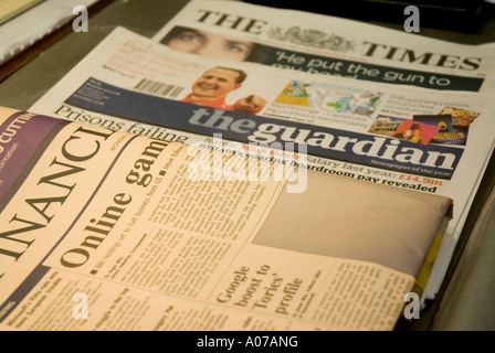 A selection of British broadsheet newspapers on a table in London England Stock Photo