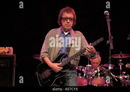 Bill Wyman playing electric bass guitar Stock Photo