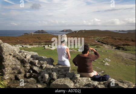 hilltop ruin of King Charles Castle Tresco Isles of Scilly with two ladies looking at view Stock Photo