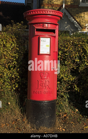 Traditional British Post Box in Rural Village Stock Photo