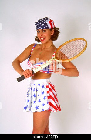Portrait of a Young Woman in a Tennis Outfit Holding a Tennis Racket