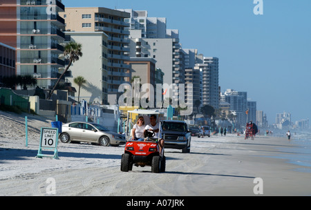 Daytona Beach Florida USA. Cars and carts driving along the beach. Stock Photo