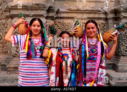 3, three, Mexican women, young women, eye contact, front view, Pineapple Dance, Guelaguetza Festival, Oaxaca, Oaxaca de Juarez, Oaxaca State, Mexico Stock Photo