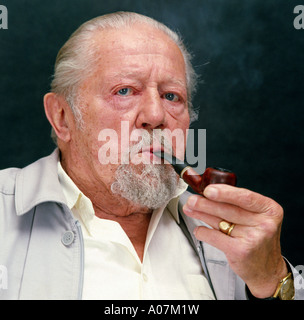 MR old bearded man smoking a pipe Stock Photo
