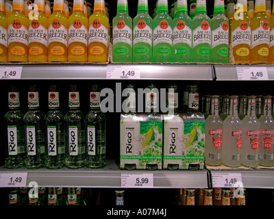 shelf with different gaudy coloured alcopops alcoholic lemonades for sale Stock Photo