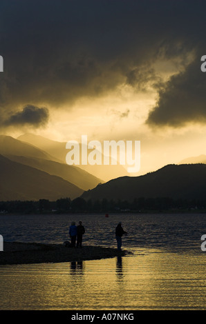 Sunset and storm clouds over the silhouetted mountains across Loch Linnhe, Scotland. Stock Photo