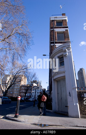 Thin building in charterhouse square with barbican estate in background Stock Photo