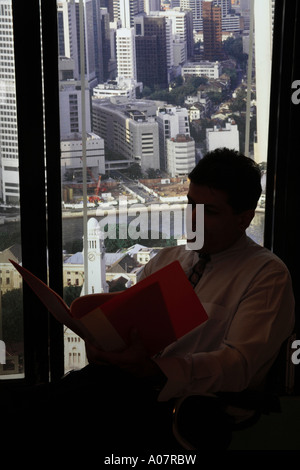 CEO portrait in his cabin in business suit with city background Stock Photo