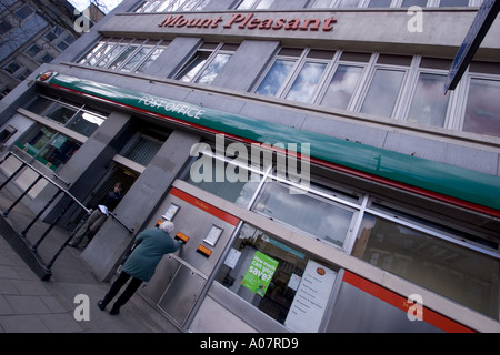Mount Pleasant main post office and sorting office London with pensioner posting letter Stock Photo