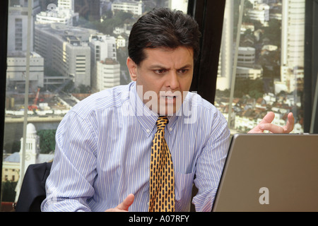 CEO serious seeing message on laptop computer in his cabin Stock Photo