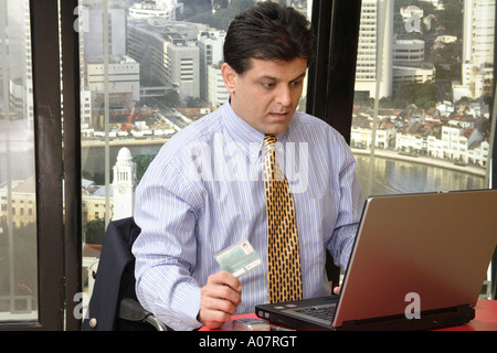 CEO thinking seeing message on laptop computer in his cabin Stock Photo
