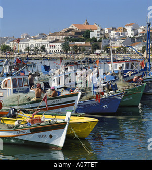 Harbour with fishermen mending nets Stock Photo