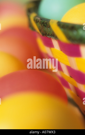 Colorful eggs in green pink yellow basket at Easter Stock Photo