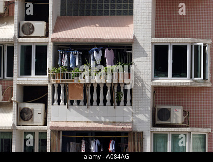 Clothes hanging out to dry on balcony in Macau South China Stock Photo