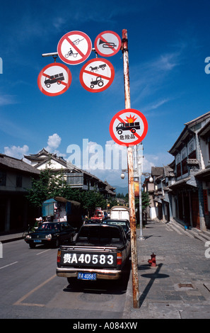 Confusing traffic signs in the old town of Dali. Stock Photo