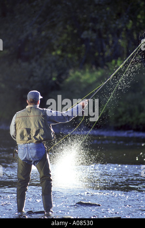 Man in hip waders salmon fishing on the Miramichi River in New Brunswick  Canada Stock Photo - Alamy
