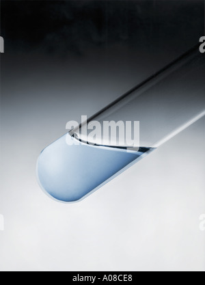 Test tube with a dark blue liquid on a white background Stock Photo - Alamy