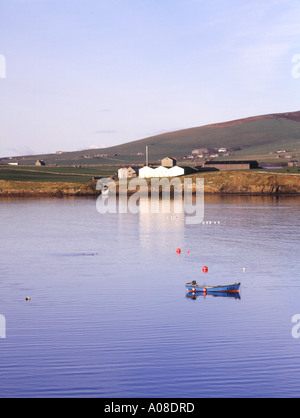 dh Scapa bay SCAPA ORKNEY Anchored boat Scapa Malt Whisky Distillery buildings shore of Scapa Flow scotland whiskey Stock Photo