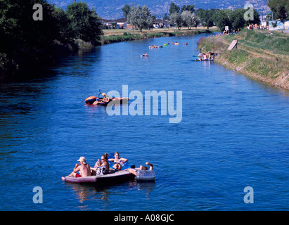 Penticton, BC, South Okanagan Valley, British Columbia, Canada - Teenagers / Teens floating on Okanagan River Channel, Summer Stock Photo