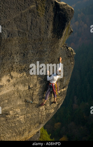 Rock Climber leading a traditional route in the Elbsandsteingebirge Germany Stock Photo