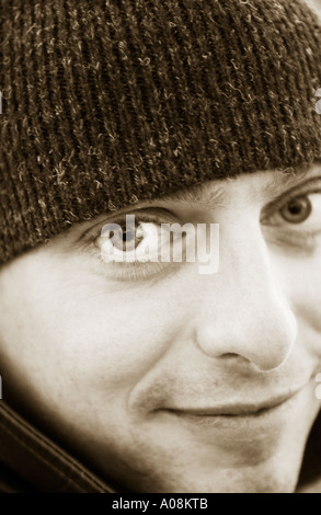 portrait of a man purple  wearing wool cap Stock Photo
