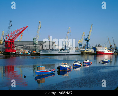 Pleasure craft with 'Swan Hunter's' ship yards beyond, Wallsend, Tyneside, Tyne and Wear, England. UK., in 1990s Stock Photo