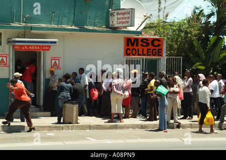 queue of customers at cash machine King Williams Town Eastern Cape South Africa RSA Stock Photo