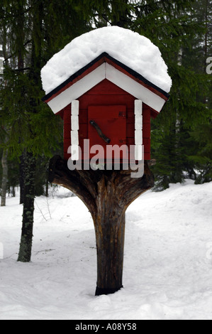 Traditional wooden food storage hut outside a Finnish Summer cottage Stock Photo