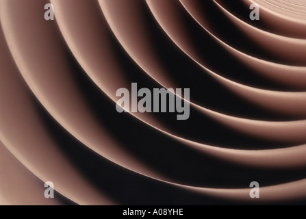Adding machine tape abstract spiraling repetitious patterns Stock Photo