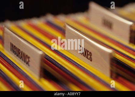Business office with multicolored hanging files and name tags. Stock Photo