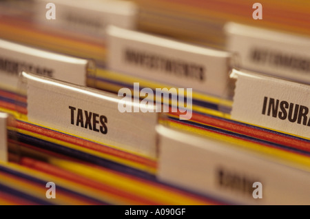 Business office with multicolored hanging files and name tags. Stock Photo