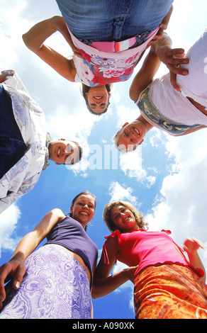 A group of young people looking down Stock Photo