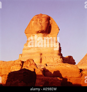 Sunrise at the Sphinx, Cairo, Egypt, North Africa. Front view Stock Photo