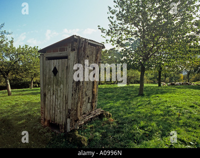 Farm outhouse lavatory dunny shithouse rustic toilet wooden Normandy France French Stock Photo