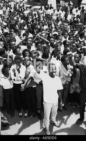 South Africa. Soweto. Crowd outside Nelson Mandela's home, waiting for the return his after release from prison. Celebrating. Singing. Stock Photo