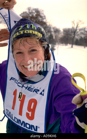 Woman age 54 at cross country ski race at Lake Phalen. St Paul Minnesota USA Stock Photo