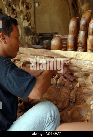 Craftsman carving complex wood carving, Ubud, Bali, Indonesia Stock