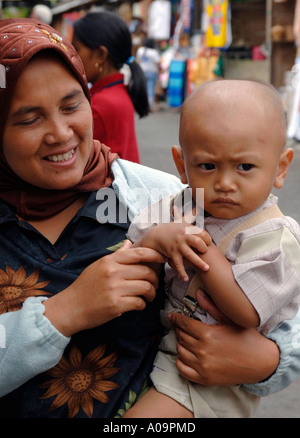 Smiling Muslim woman in black, Java Indonesia Stock Photo