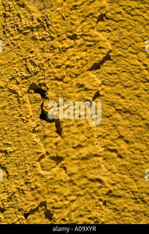 Orange painted wall with raking light forms pattern texture Stock Photo