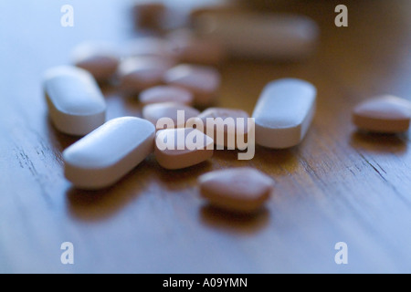 Pills spilled on a bedstand Stock Photo