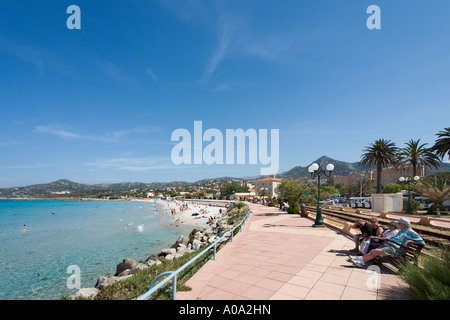 Beach and seafront promenade at L'ile Rousse, La Balagne, Corsica, France Stock Photo