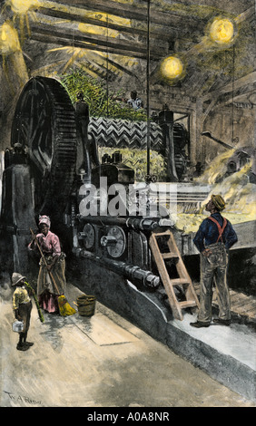 African American workers operating a cane crushing machine in a sugar house at Bayou Teche Louisiana 1900. Hand-colored halftone of an illustration Stock Photo