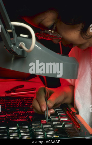 Technician works on computer boards at Point Four Company in California Stock Photo