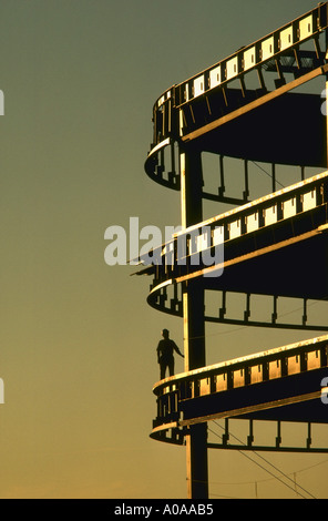 Silhouette of worker at construction site at sunrise Stock Photo