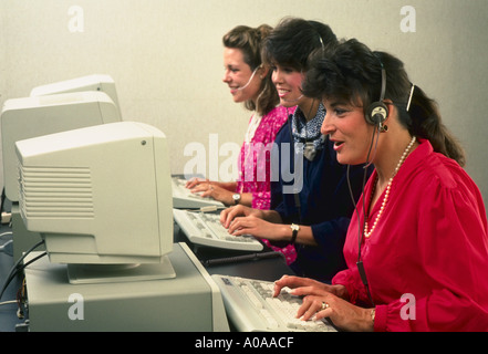 Women in front of computers telemarketing Stock Photo