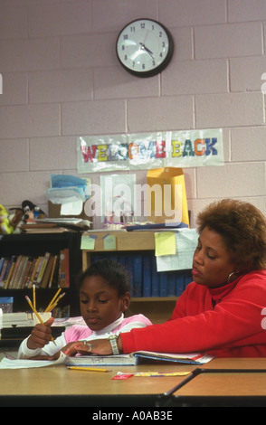 Student with teacher in after school study hall model released Stock Photo