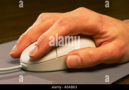 Hand on mouse Stock Photo