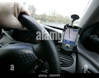A Pocket PC GPS system mounted in a car Stock Photo